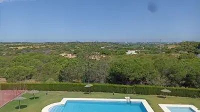 Casa Adosada en Pinares de Lepe con Piscina
