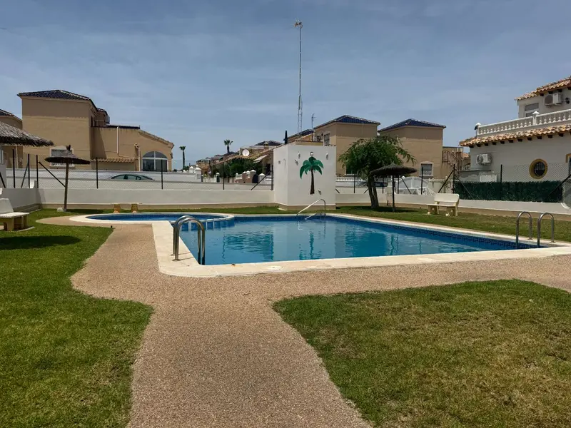 Casa Adosada Reformada en Punta Prima con Piscina