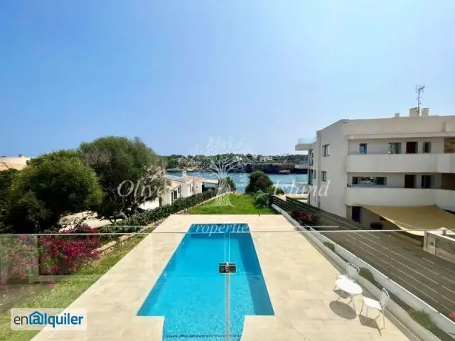 Luminoso apartamento con piscina, jardín y acceso directo al mar en alquiler en Portocolom