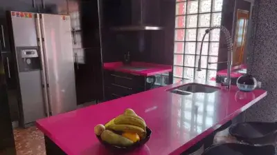 Chalet Adosado en La Joya con Piscina y Cochera Habilitada