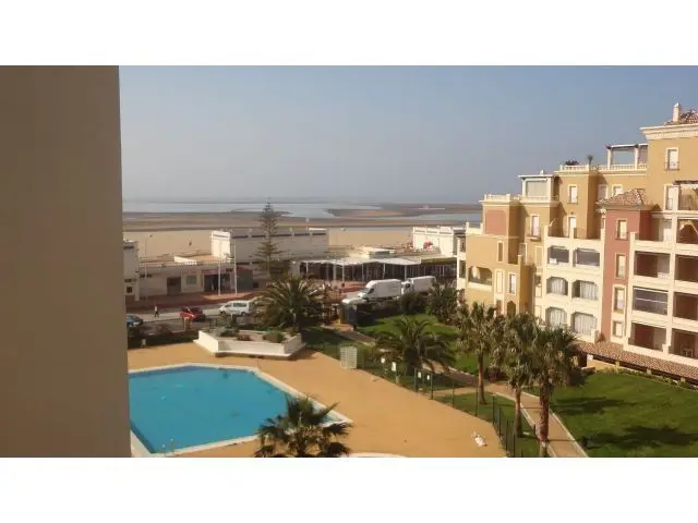 Apartamento en Isla Canela Primera Linea de Playa con Piscina y Garaje